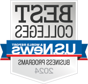 Logo of U.S. News & World Report featuring the text 'BEST COLLEGES', 'USN&WR', and 'Business Programs 2024' on a badge with a gray and white color scheme and blue and red ribbons.